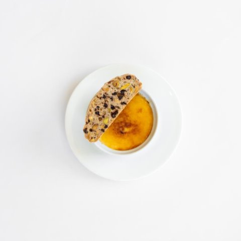 VANILLA BRÛLÉE WITH ALMOND BISCOTTICreamy Vanilla Custard with Crispy Caramelised Sugar and Homemade Almond Biscotti