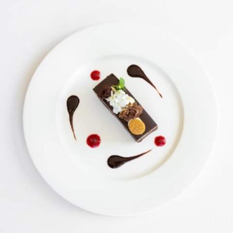 CHOCOLATE CARAMEL MACADAMIA BROWNIELayered with Chocolate Caramel Mousse and Chocolate Ganache