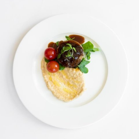 LAMB SHOULDER ROULADESlow Cooked Lamb Shoulder Roulade with Hummus, Cherry Tomato and Caramelised Onion
