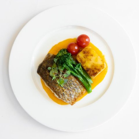 PAN FRIED BARRAMUNDIwith Spiced Carrot Puree, Seasonal Greens, Potato Gratin and Confit Cherry Tomato (GF, NF, DF Pesc)