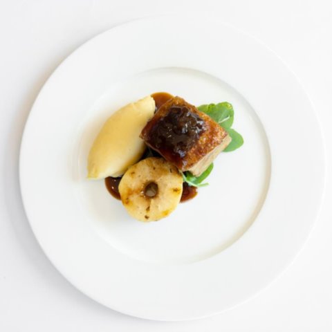 CRISPY SKIN PORK BELLYMash Potato, Roasted Apple and Caramelised Onion Jus (GF, NF)