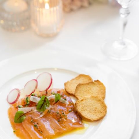 HOUSE CURED SALMONAtlantic Salmon cured in White Wine with Lemon Jelly, Pickle Fennel, Cucumber, Tobiko Caviar, Crostini and Soft Herbs (GF, NF, DF)