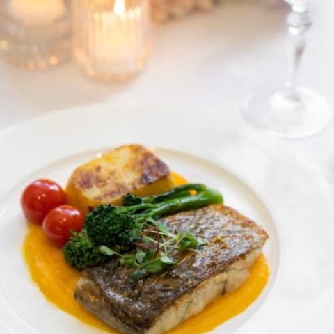 PAN FRIED BARRAMUNDIwith Spiced Carrot Puree, Seasonal Greens, Potato Gratin and Confit Cherry Tomato (GF, NF, DF Pesc)